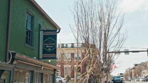 Photo of Galvin's Deli Blade sign on green building in downtown Fredericksburg. Sign was manufactured by Distinct Sign Solutions in Fredericksburg, VA