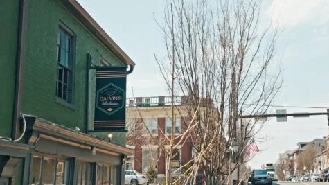 Photo of Galvin's Deli Blade sign on green building in downtown Fredericksburg. Sign was manufactured by Distinct Sign Solutions in Fredericksburg, VA