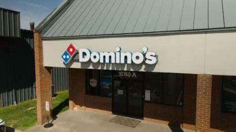 Photo of Domino's Pizza channel letter sign on EIFS facade in Spotsylvania, VA. Sign was repaired & retrofit by Distinct Sign Solutions in Fredericksburg, VA