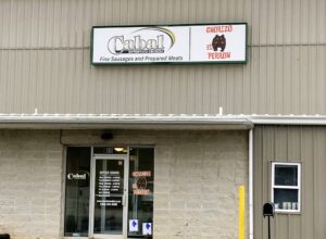 Photo of flex face cabinet mounted to corrugated metal wall in Stafford, VA. Sign was manufactured & installed by Distinct Sign Solutions in Fredericksburg, VA