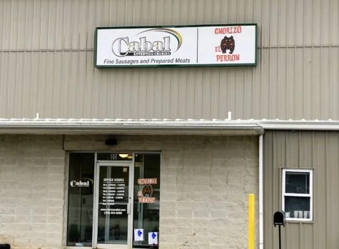 Photo of flex face cabinet mounted to corrugated metal wall in Stafford, VA. Sign was manufactured & installed by Distinct Sign Solutions in Fredericksburg, VA