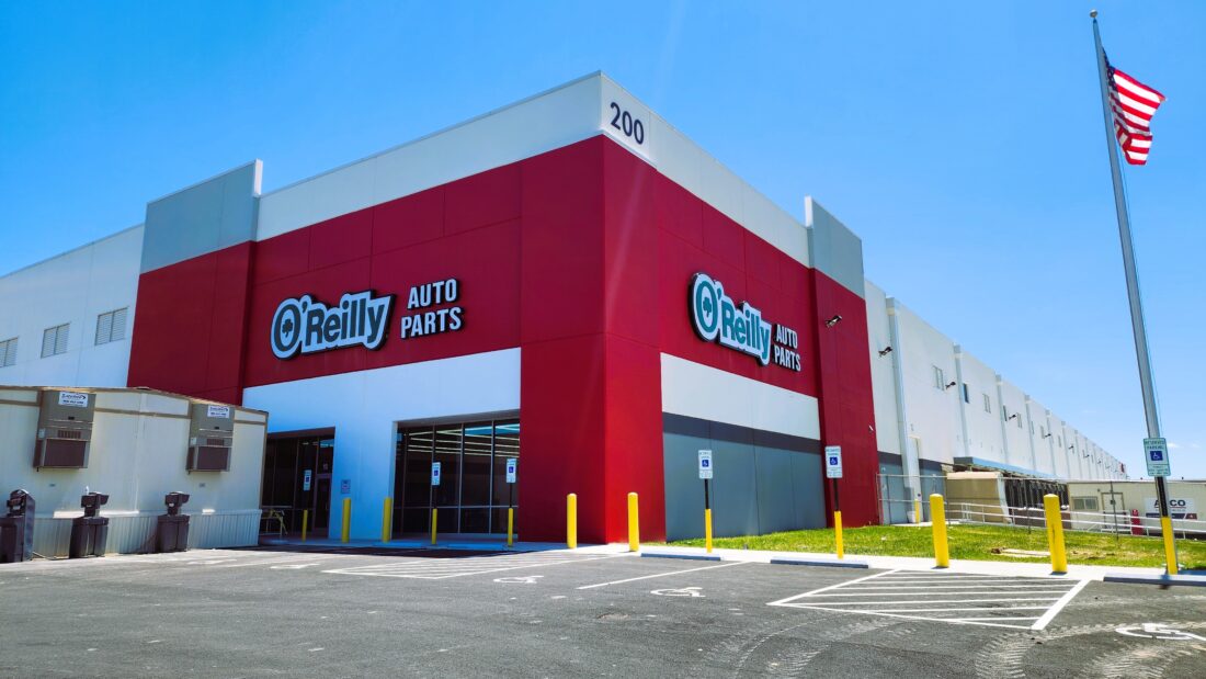 Photo of two large Oreilly Auto Parts sets set onto large red walls in Stafford, VA. Signs were installed by Distinct Sign Solutions in Fredericksburg, VA
