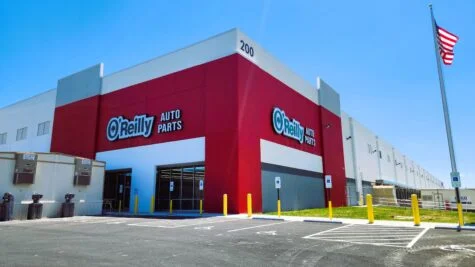 Photo of two large Oreilly Auto Parts sets set onto large red walls in Stafford, VA. Signs were installed by Distinct Sign Solutions in Fredericksburg, VA