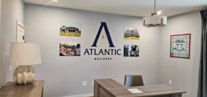 Photo of model home wall with various acrylic signage in Spotsylvania, VA. Signs were manufactured & installed by Distinct Sign Solutions in Fredericksburg, VA