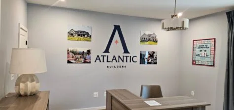 Photo of model home wall with various acrylic signage in Spotsylvania, VA. Signs were manufactured & installed by Distinct Sign Solutions in Fredericksburg, VA