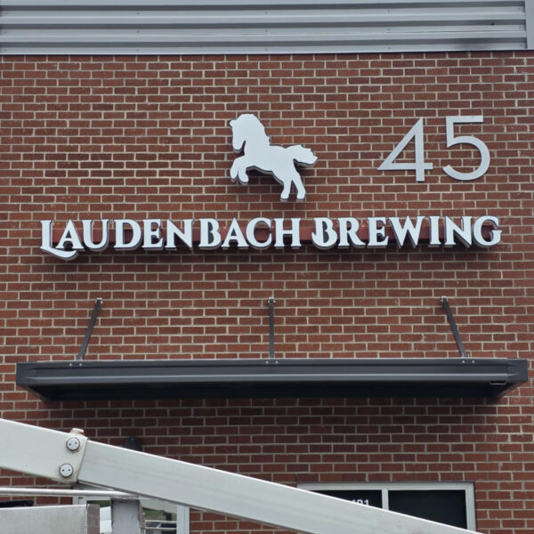Exterior building signage for Laudenbach Brewing with dimensional letters and horse icon