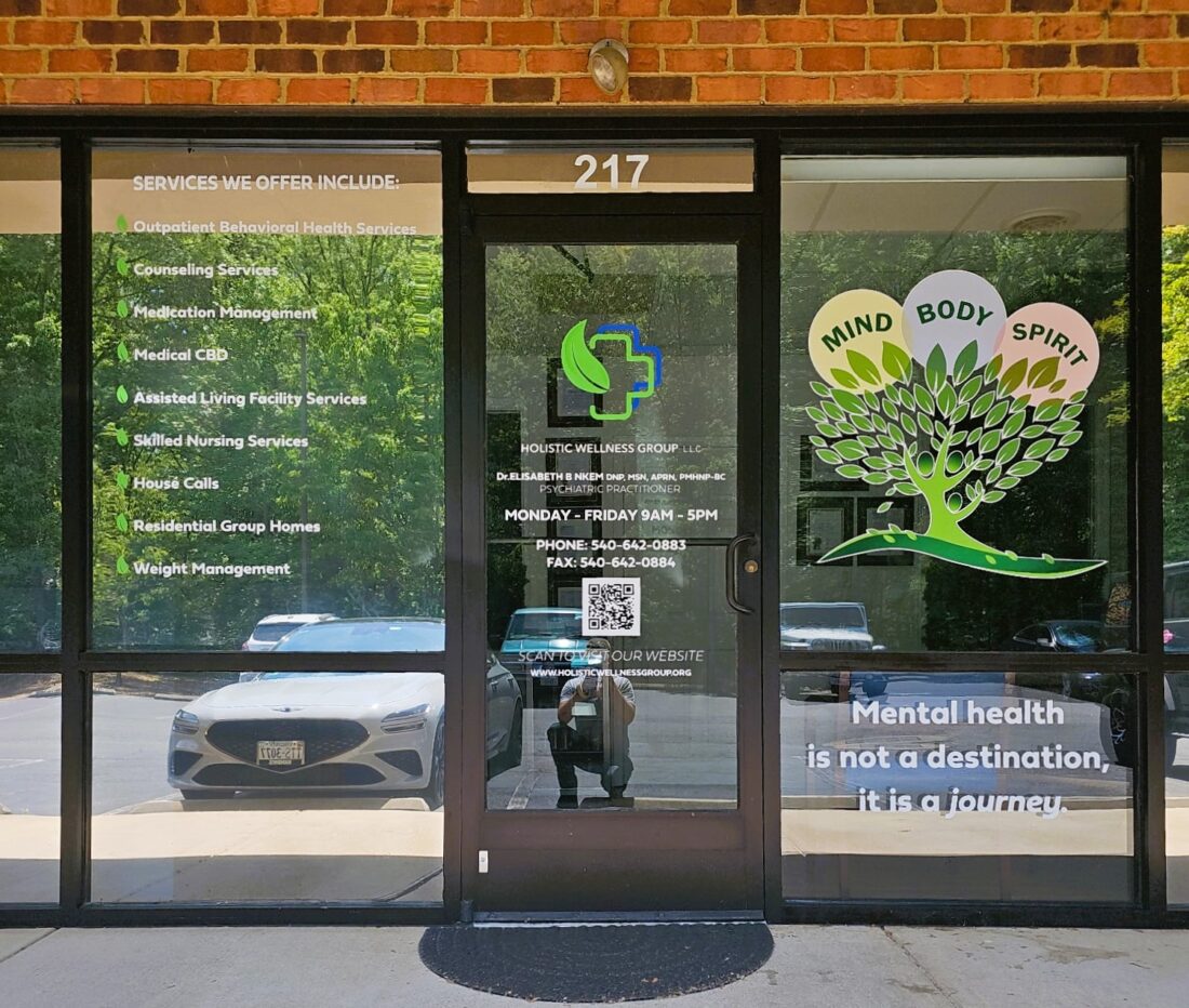 Photo of exterior storefrontage with various vinyl graphics for Holistic Wellness Group in Spotsylvania, VA. Graphics were manufactured & installed by Distinct Sign Solutions in Fredericksburg, VA
