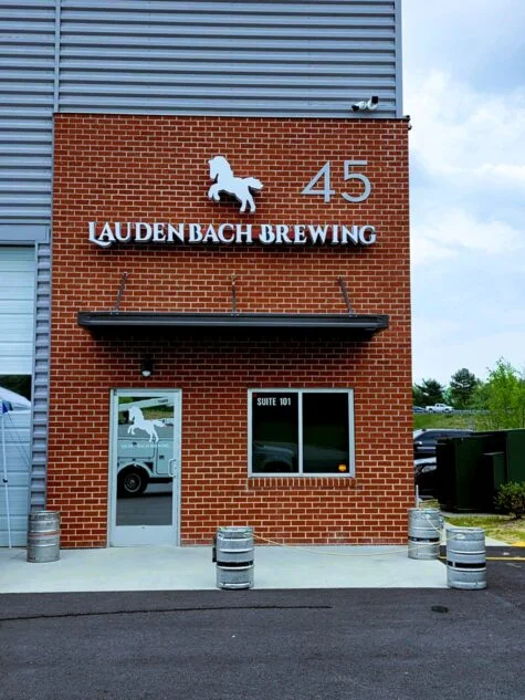 Photo of white horse channel letter sign mounted to brick wall in Stafford, VA. Sign was manufactured & installed by Distinct Sign Solutions in Fredericksburg, VA