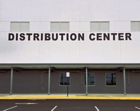 Photo of large black letters reading DISTRIBUTION CENTER mounted to EIFS wall on O'Reilly Auto Parts Distribution Center in Stafford, VA. Sign was manufactured & installed by Distinct Sign Solutions in Fredericksburg, VA