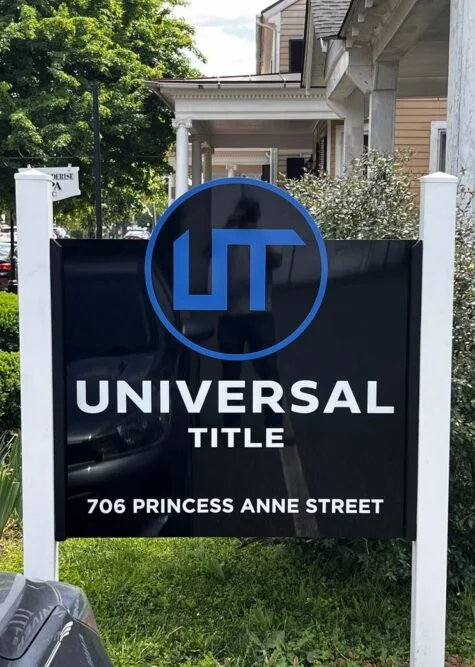 Photo of black post & panel sign for Universal Title in Fredericksburg, VA. Sign was manufactured & installed by Distinct Sign Solutions in Fredericksburg, VA