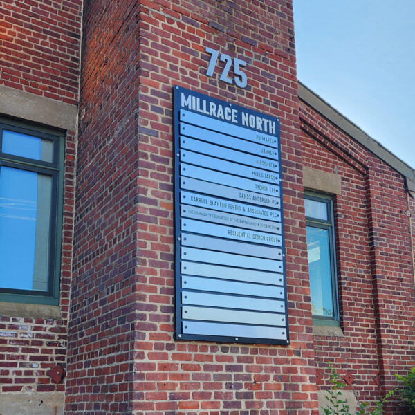 Exterior directory sign mounted on brick column at Millrace North office building