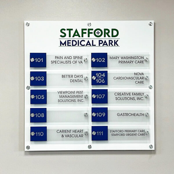 Wall-mounted tenant directory at Stafford Medical Park with suite numbers and healthcare provider names