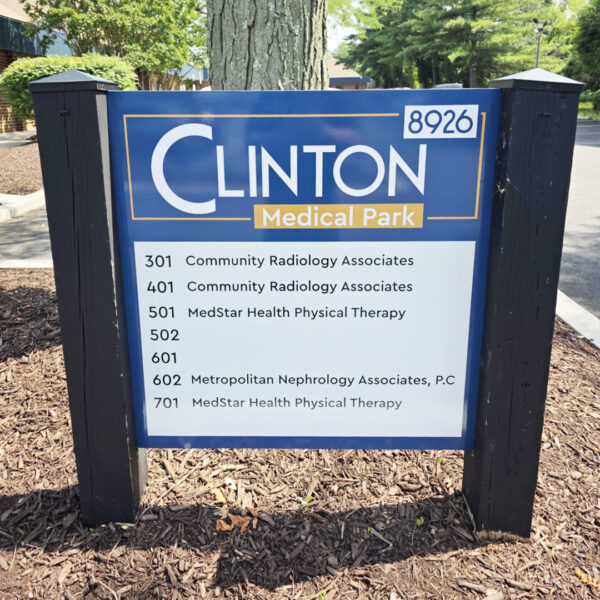 Ground-mounted tenant sign listing suites and healthcare providers at Clinton Medical Park
