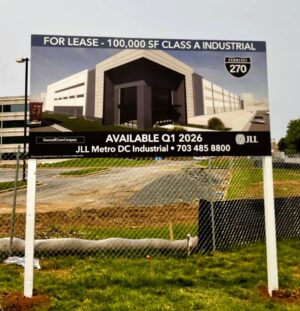 Photo of large post & panel sign in grassy area in Rockville, MD for JLL Mid Atlantic. Sign was manufactured & installed by Distinct Sign Solutions in Fredericksburg, VA
