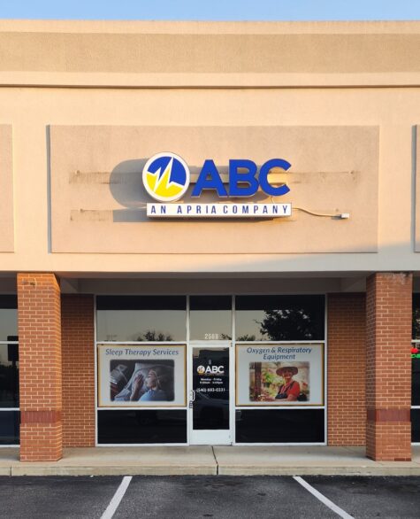Photo of blue, yellow, and white channel letter sign mounted to EIFS wall in Fredericksburg, VA. Sign was manufactured by Distinct Sign Solutions in Fredericksburg, VA