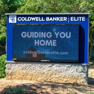 Coldwell Banker Elite monument sign with UL-Listed message center during install in Stafford, VA.