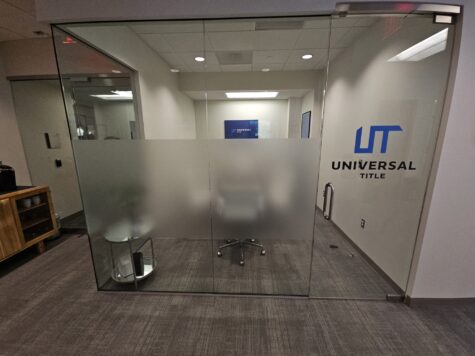 Photo of interior conference room for Universal Title in Fairfax VA. Frosted Vinyl and colored vinyl was applied to glass walls. Graphics were manufactured & installed by Distinct Sign Solutions in Fredericksburg, VA