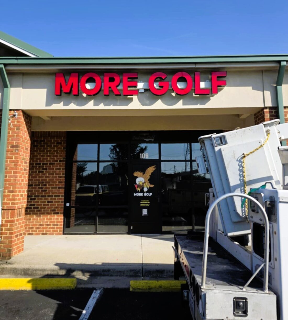 Photo of bright red illuminated channel letter sign for MORE GOLF in Spotsylvania, VA. Sign was manufactured & installed by Distinct Sign Solutions in Fredericksburg, VA