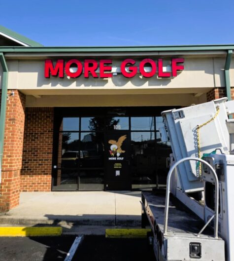 Photo of bright red illuminated channel letter sign for MORE GOLF in Spotsylvania, VA. Sign was manufactured & installed by Distinct Sign Solutions in Fredericksburg, VA