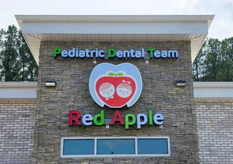 Photo of colorful channel letter sign mounted to stone wall in Stafford, VA. Sign was manufactured & installed by Distinct Sign Solutions in Fredericksburg, VA