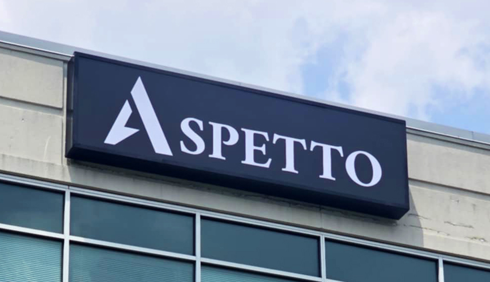 Photo of black & white sign cabinet affixed to tall building in Stafford, VA. Sign was manufactured & installed by Distinct Sign Solutions in Fredericksburg, VA