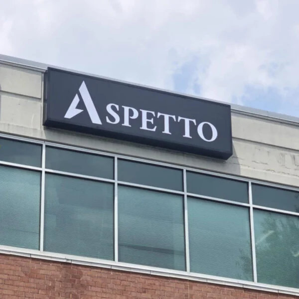Sign cabinet installed by Distinct Sign Solutions for Aspetto in Fredericksburg, VA. Modern exterior signage for a defense and tactical apparel company.