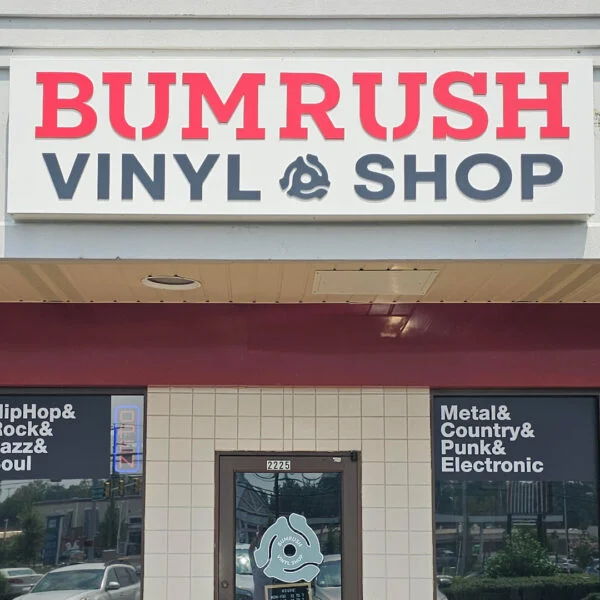 Retro-style sign cabinet installed by Distinct Sign Solutions for Bumrush Vinyl Shop in Fredericksburg, VA. Eye-catching design for a niche retail store.