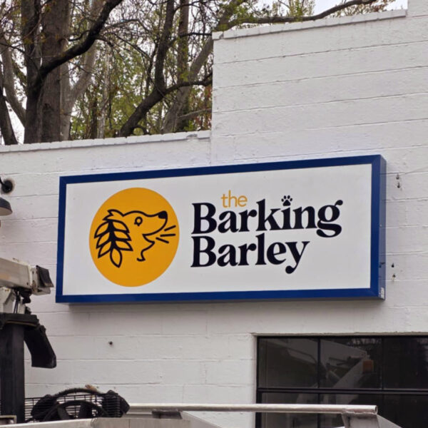 Custom sign cabinet installed by Distinct Sign Solutions for The Barking Barley in Fredericksburg, VA. Brewery signage that blends branding with architectural detail.