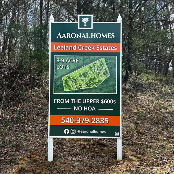 Aaronal Homes sign for Leeland Creek Estates highlighting 3 to 9 acre lots with no HOA.