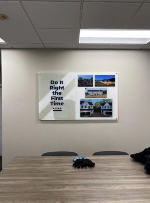 Photo of custom printed acrylic wall sign affixed with standoffs on office wall. Sign was designed, manufactured & installed by Distinct Sign Solutions in Fredericksburg, VA