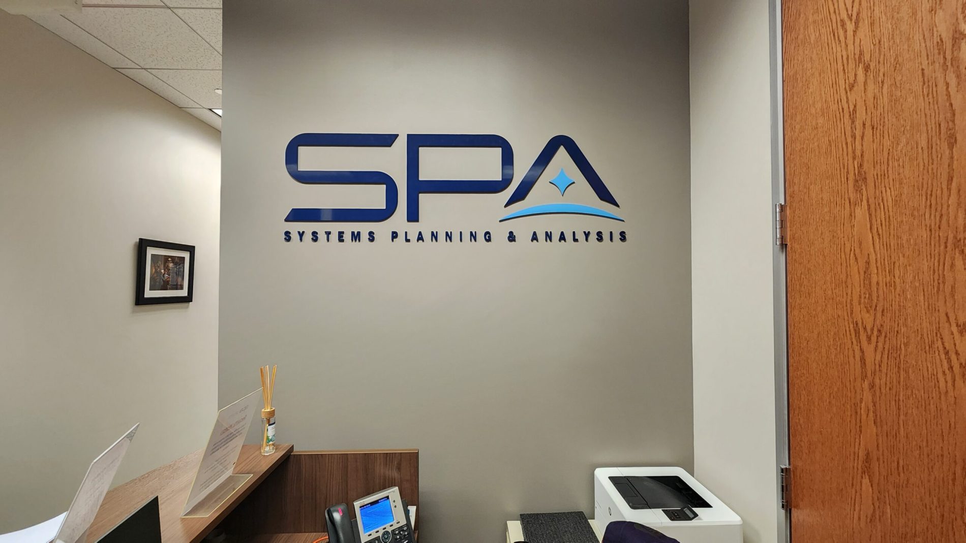 Systems Planning and Analysis (SPA) partnered with Distinct Sign Solutions for Custom office signage in Washington DC.